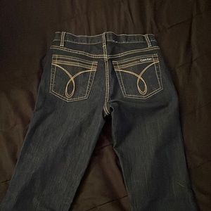 dark washed low waisted calvin klein boot cut/ flared jeans Size 6 in women